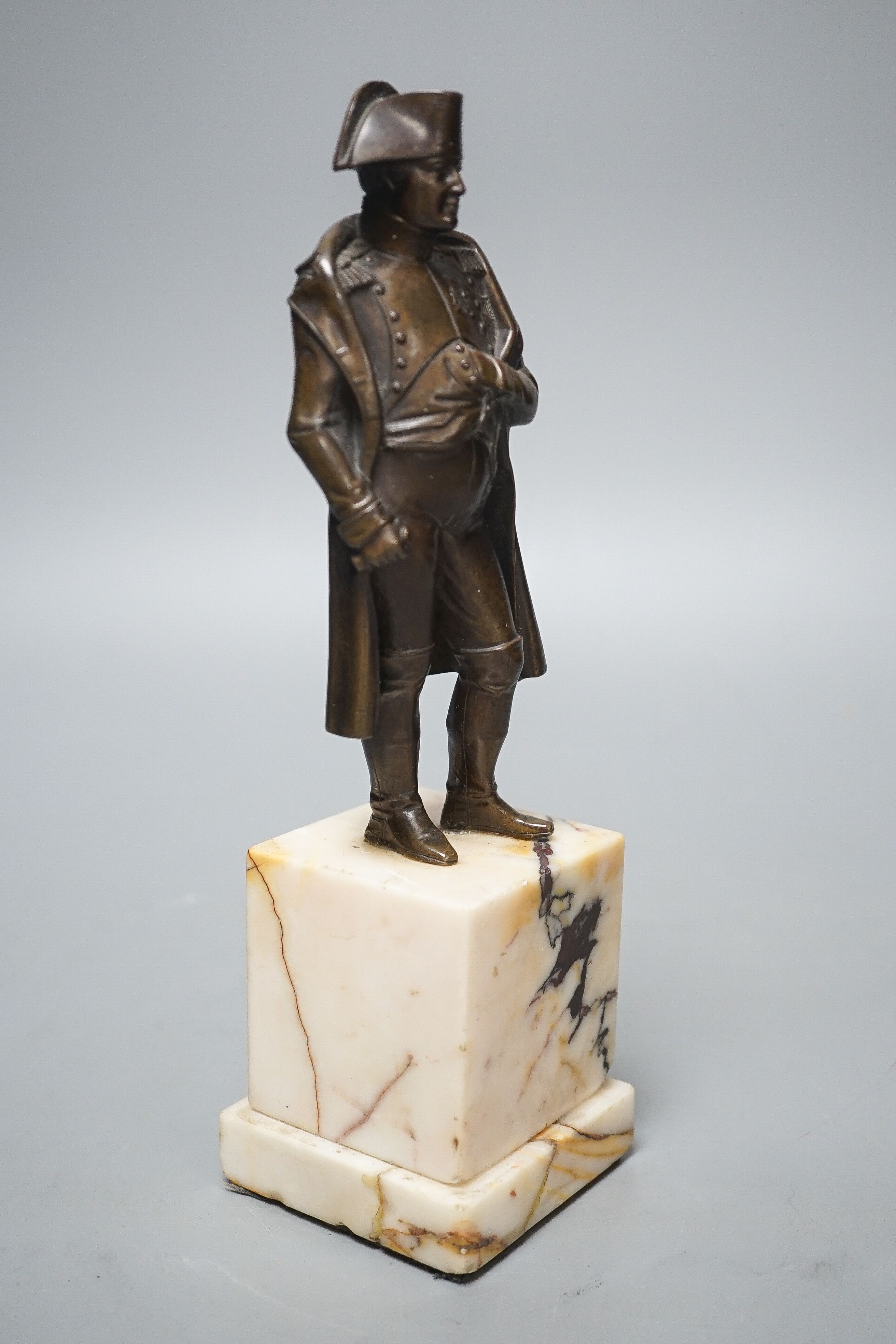 A bronze figure of Napoleon on marble base and two related prints ‘Porto Ferrajo’ and ‘Grand Entry of the Allied Sovereigns into Paris’ bronze 24cm tall